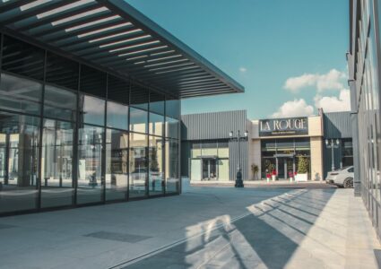 shopping arcade featuring modern architecture and glass facades