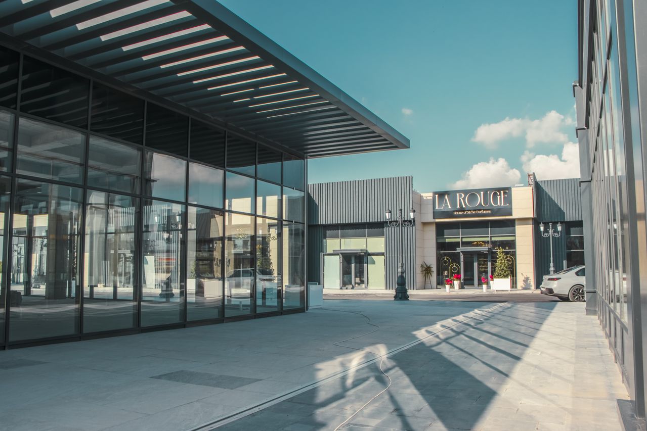 shopping arcade featuring modern architecture and glass facades