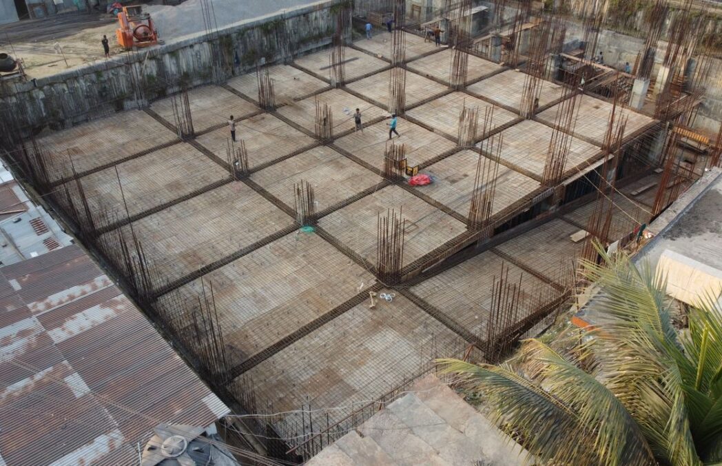 closw onstruction workers at a large building site
