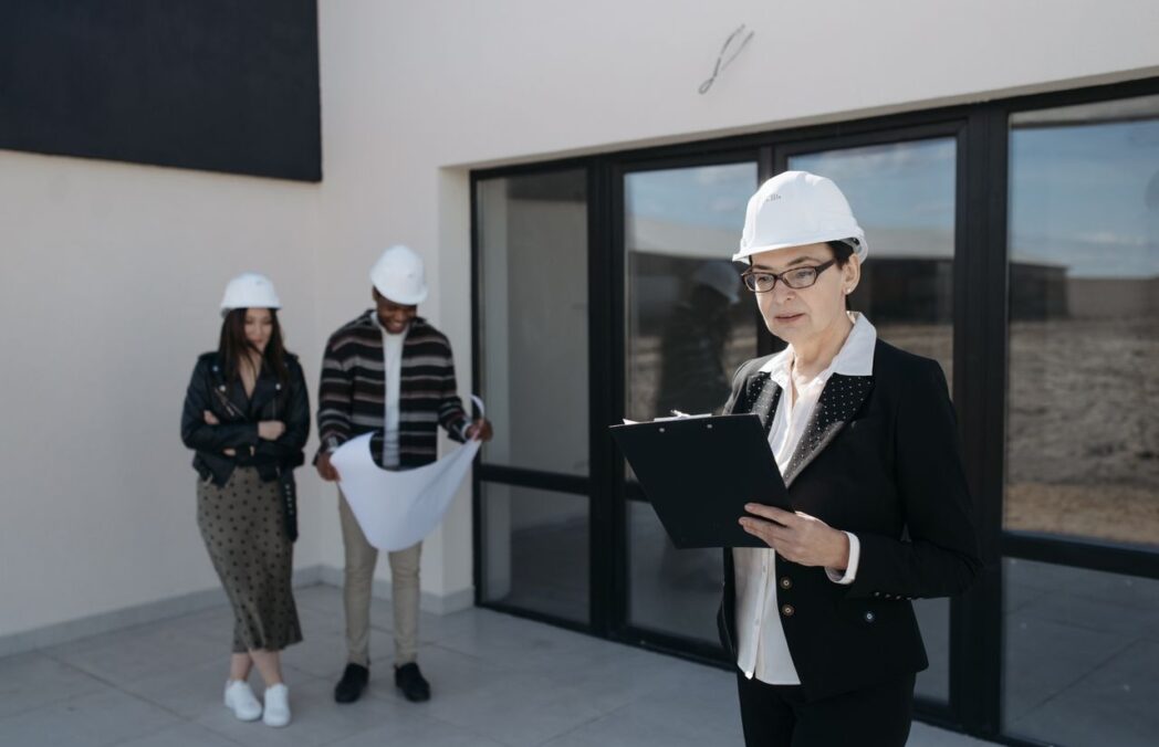 CLOSW Construction project manager reviewing plans with client