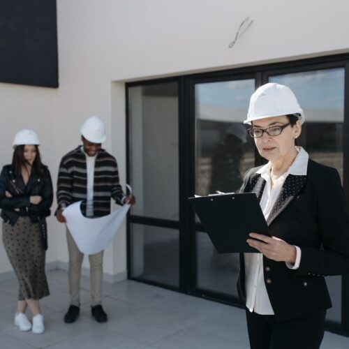 CLOSW Construction project manager reviewing plans with client