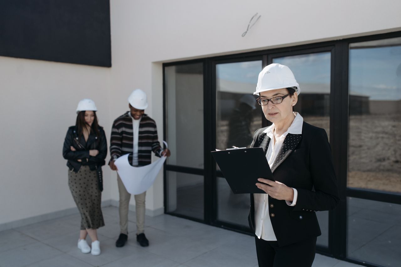 CLOSW Construction project manager reviewing plans with client