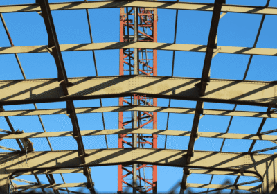 View of a steel construction framework under clear blue sky